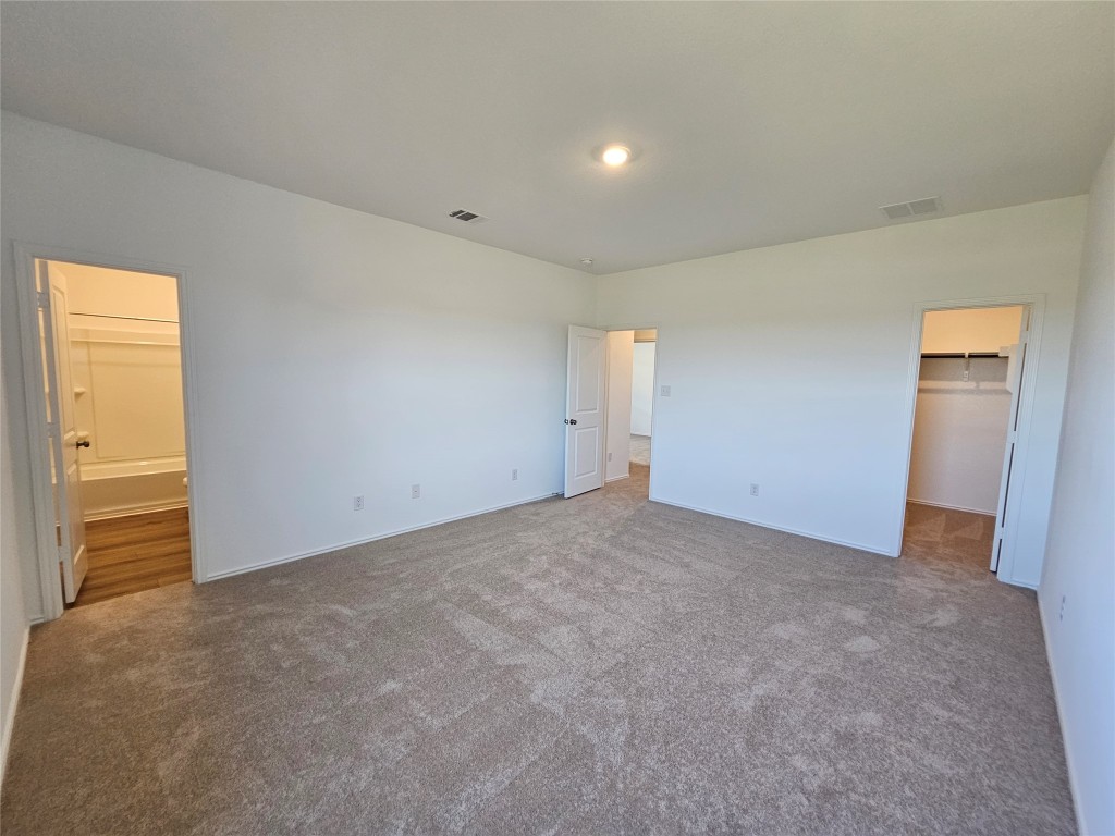 856 Rancho Del Cielo Loop Jarrell, TX 76537 - Photo 15 of 35 a view of an empty room