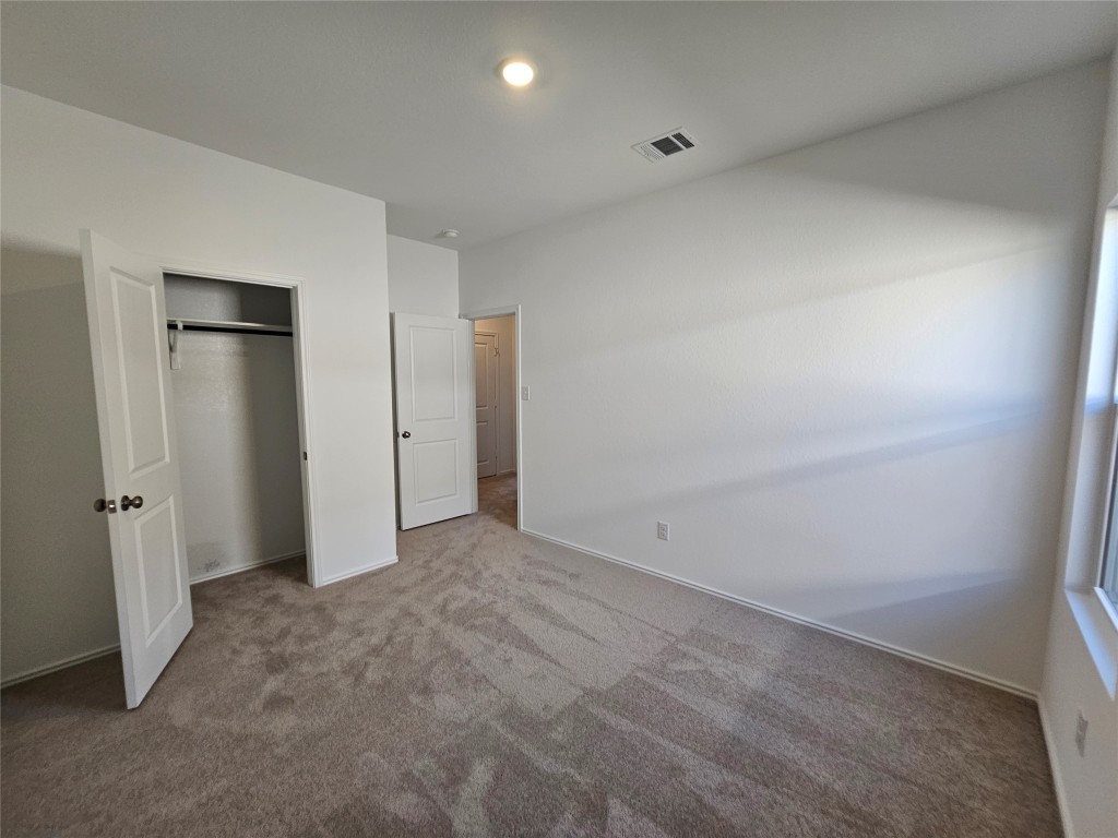 856 Rancho Del Cielo Loop Jarrell, TX 76537 - Photo 20 of 35 an empty room with an entryway