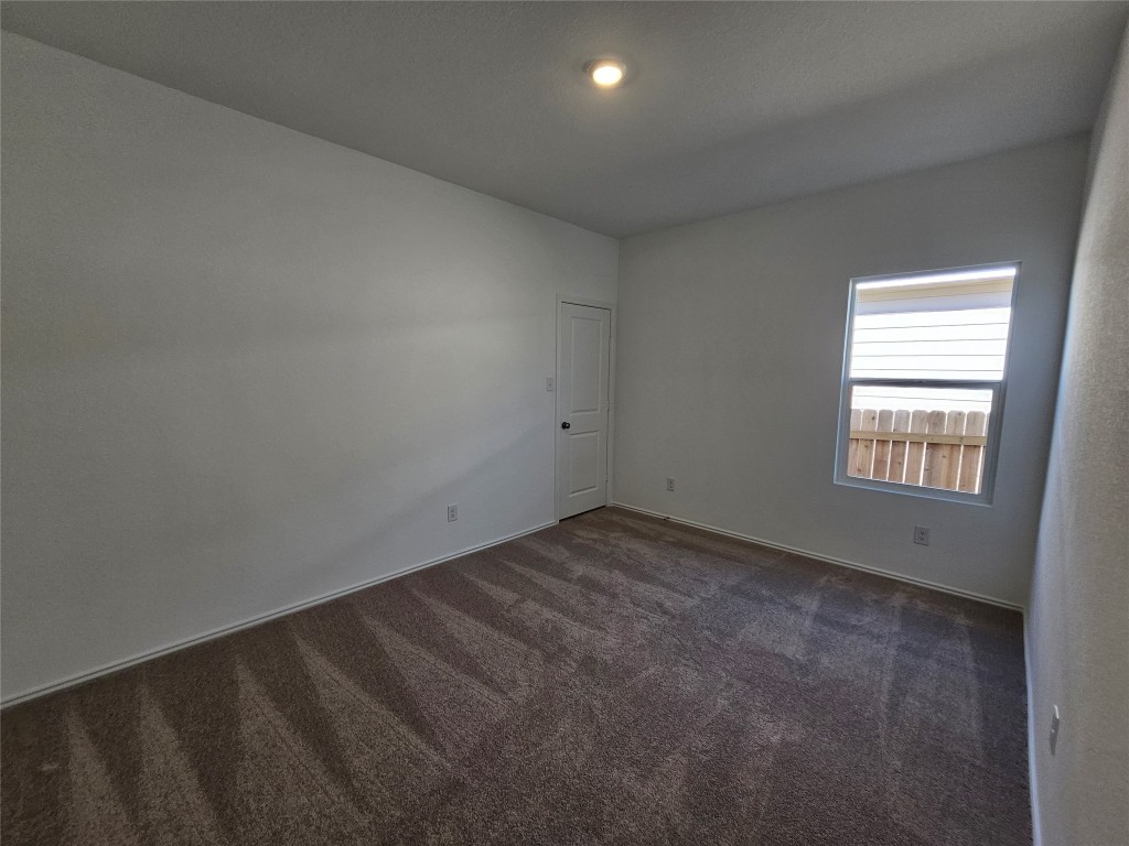856 Rancho Del Cielo Loop Jarrell, TX 76537 - Photo 22 of 35 an empty room with a window
