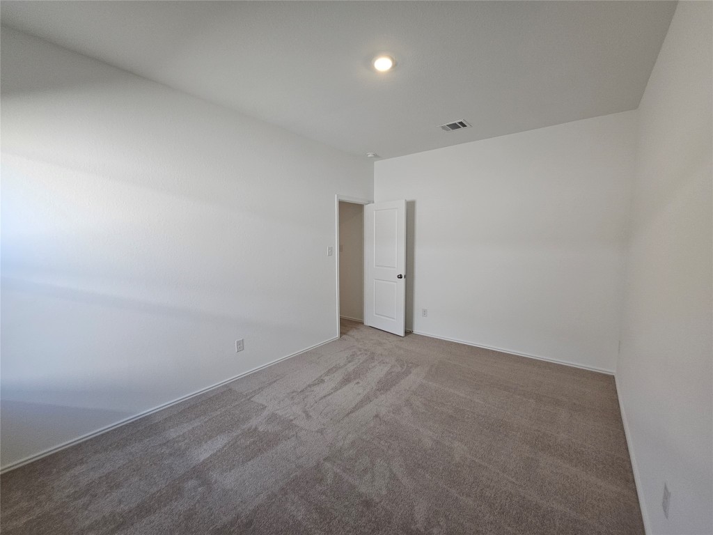 856 Rancho Del Cielo Loop Jarrell, TX 76537 - Photo 23 of 35 a view of an empty room