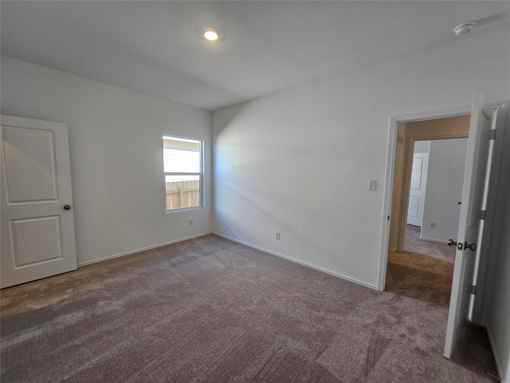 856 Rancho Del Cielo Loop Jarrell, TX 76537 - Photo 26 of 35 an empty room with windows