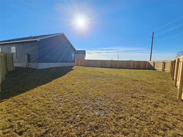 a view of a swimming pool with an outdoor space and seating area