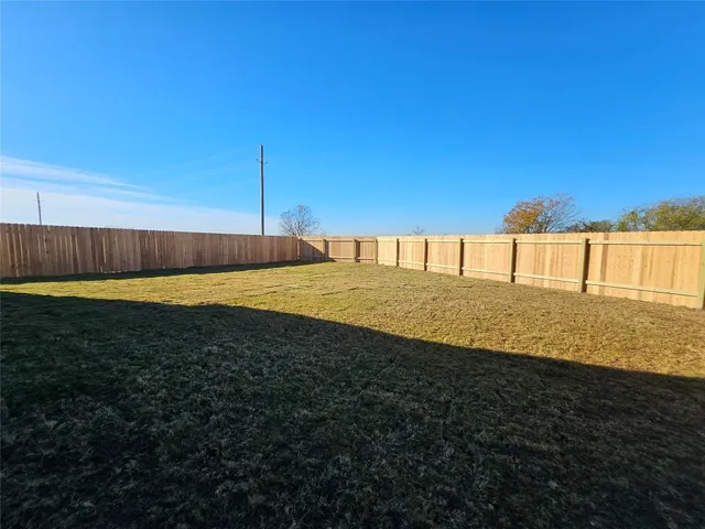 a bathroom with a mirror and a shower
