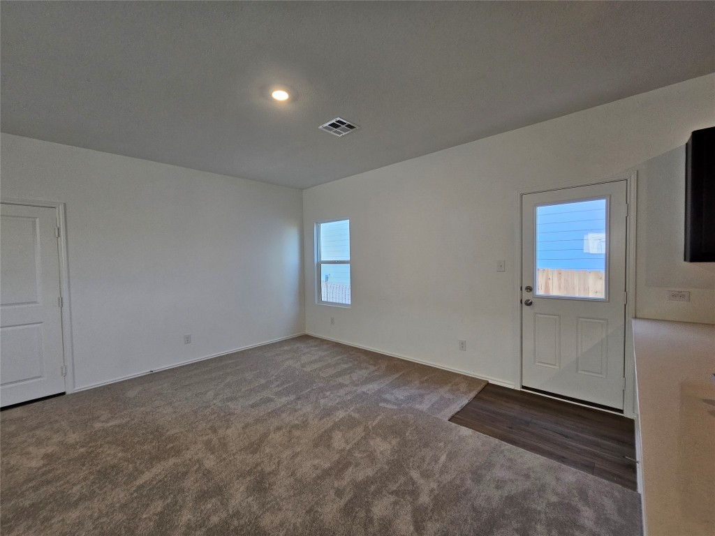 856 Rancho Del Cielo Loop Jarrell, TX 76537 - Photo 6 of 35 an empty room with windows