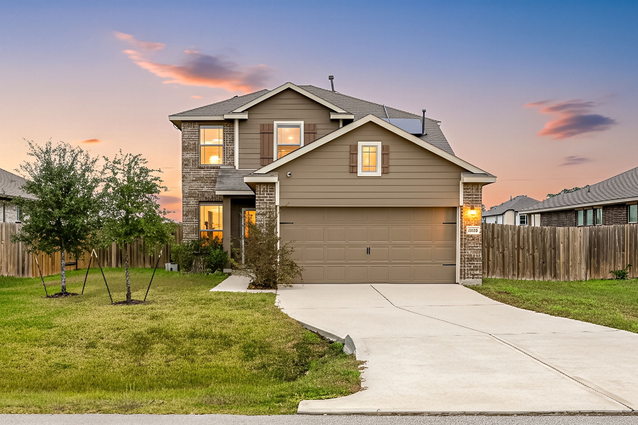 a front view of a house with a yard