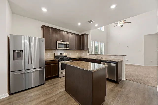 a bathroom with a sink a mirror and a toilet