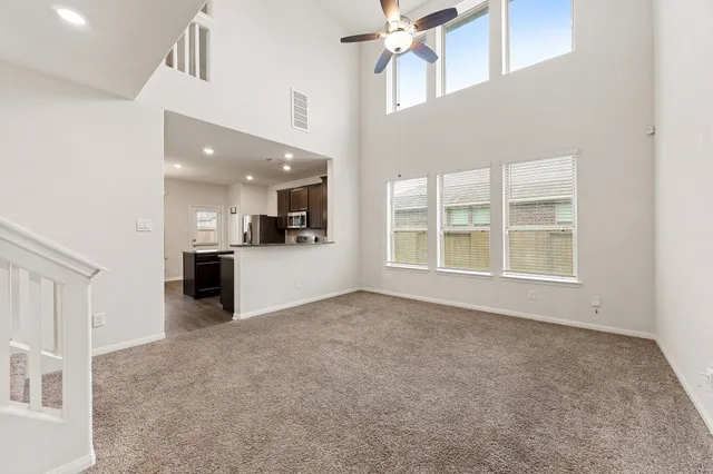 a kitchen with kitchen island a counter top space stainless steel appliances and cabinets