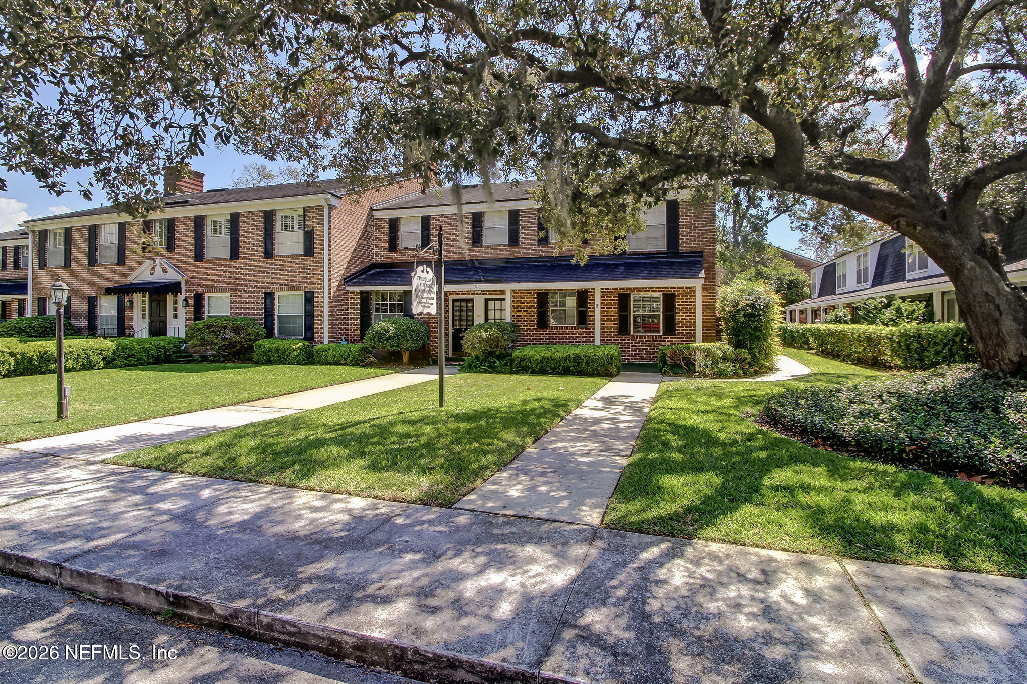 4358 Timuquana Road, Unit 134 Jacksonville, FL 32210 - Photo 28 of 31 a front view of a house with a yard and potted plants
