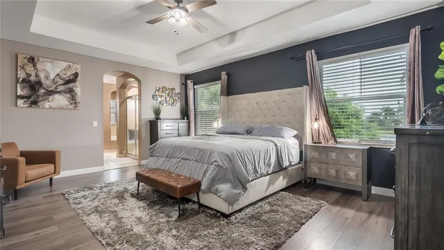a bathroom with a glass shower door and a mirror