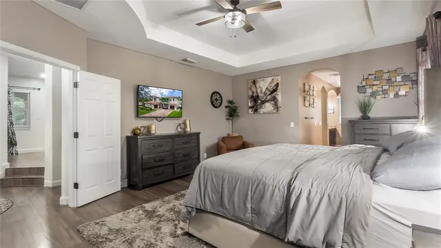 a bathroom with a granite countertop sink and a bathtub