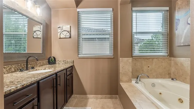 a white bath tub sitting next to a white toilet