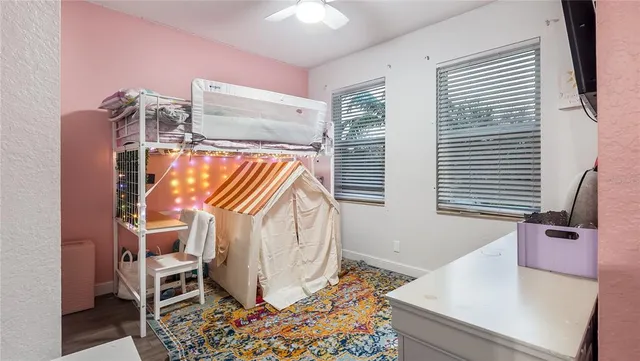 a bedroom with a bed and furniture