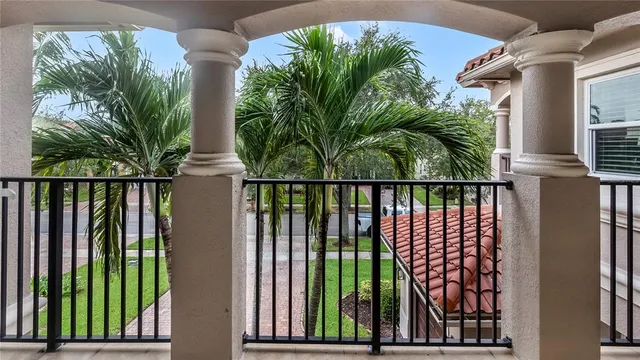 a view of a house with a backyard and a patio
