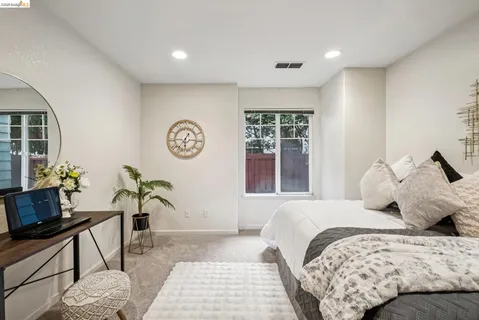 a bedroom with bed and a window