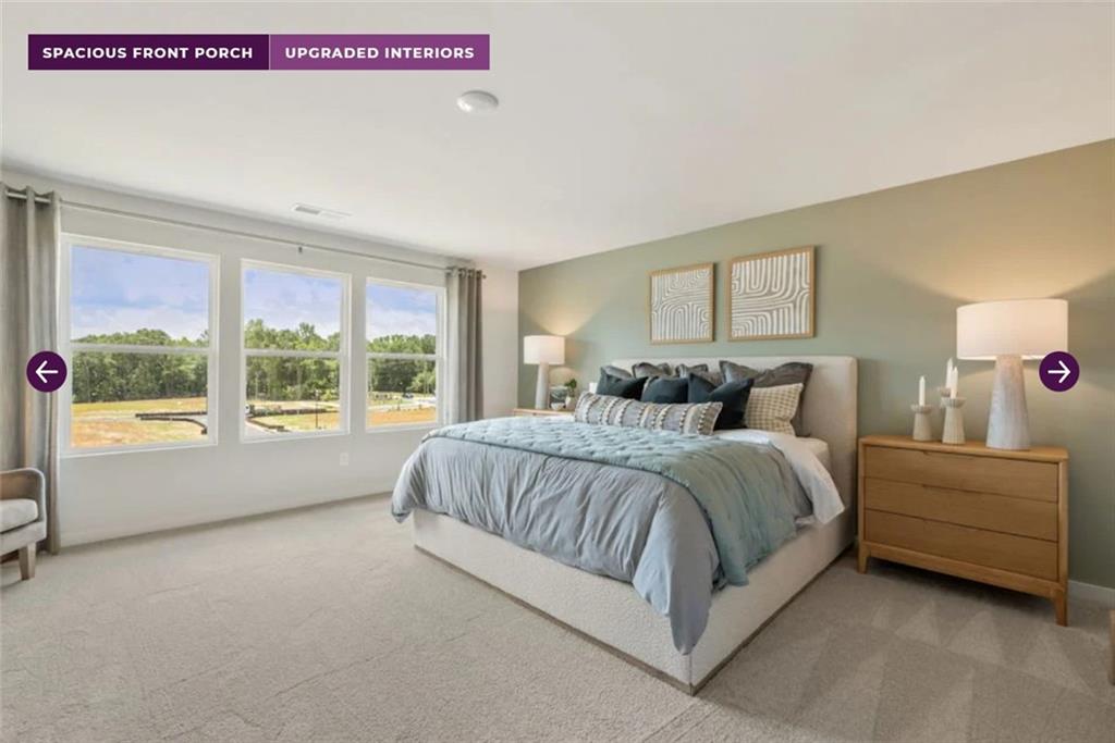 108 Winding Rdg Trail Jefferson, GA 30549 - Photo 26 of 31 a spacious bedroom with a bed and a window