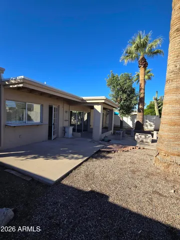 a view of a house with swimming pool