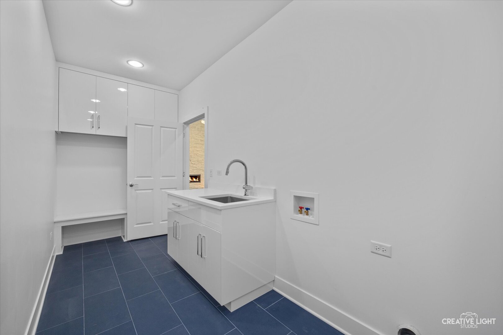 7625 Dunham Road Woodridge, IL 60517 - Photo 11 of 25 a room with a sink and a washer dryer