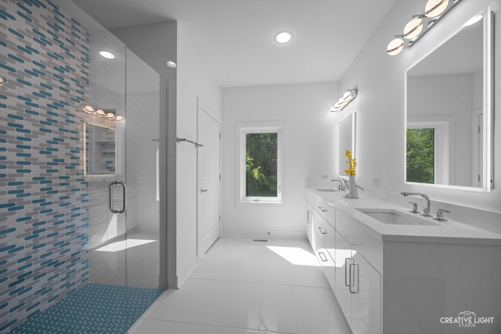 7625 Dunham Road Woodridge, IL 60517 - Photo 12 of 25 a bathroom with a double vanity sink toilet and shower