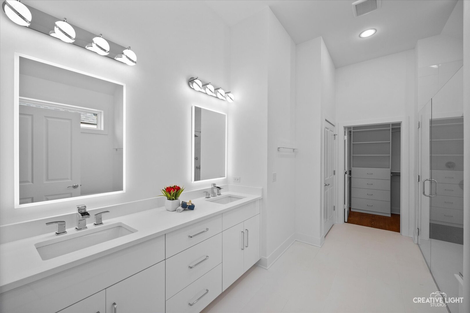 7625 Dunham Road Woodridge, IL 60517 - Photo 16 of 25 a bathroom with double sink and a mirror