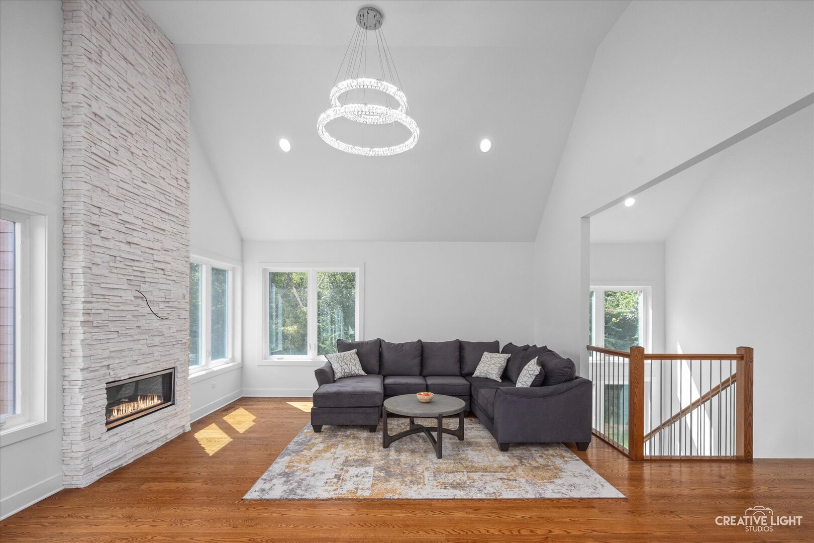 7625 Dunham Road Woodridge, IL 60517 - Photo 5 of 25 a living room with furniture wooden floor and a fireplace