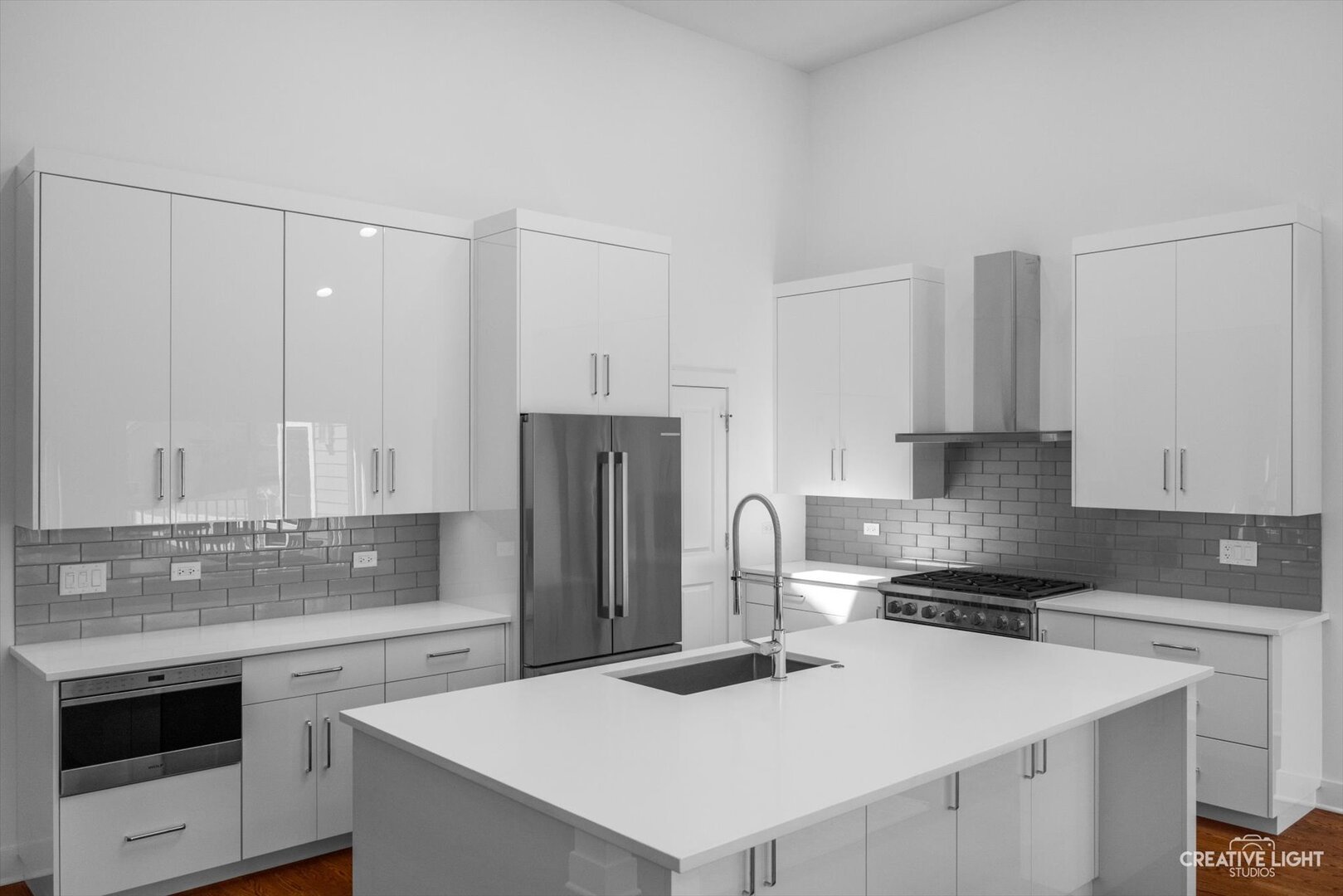 7625 Dunham Road Woodridge, IL 60517 - Photo 7 of 25 a kitchen with refrigerator and white cabinets