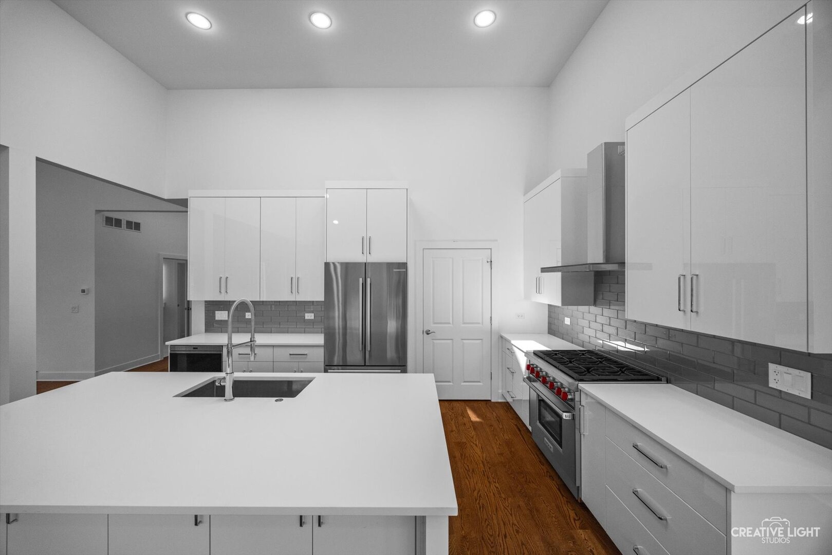 7625 Dunham Road Woodridge, IL 60517 - Photo 9 of 25 a kitchen with kitchen island stainless steel appliances a sink stove and refrigerator