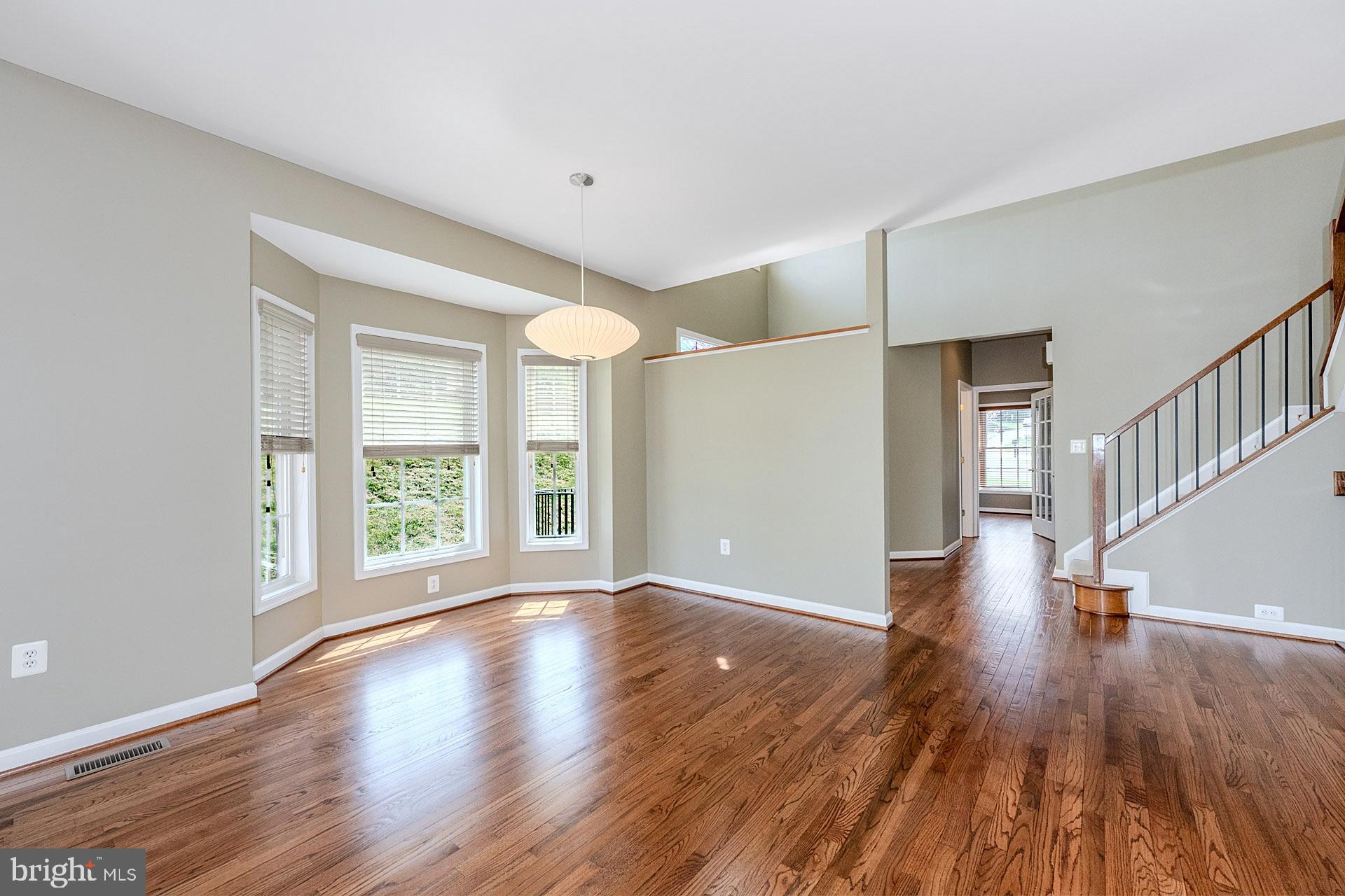 230 West Ridge Court Warrenton, VA 20186 - Photo 12 of 44 a view of an empty room with wooden floor and a window