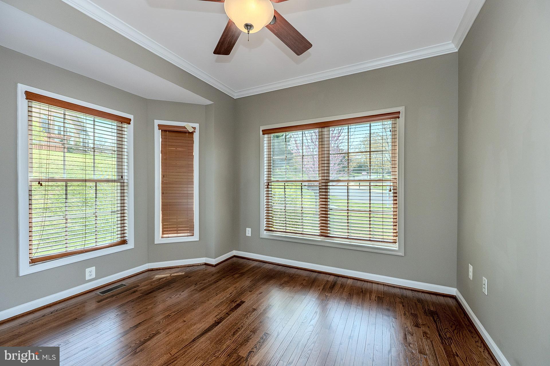 230 West Ridge Court Warrenton, VA 20186 - Photo 19 of 44 a view of an empty room with wooden floor and a window