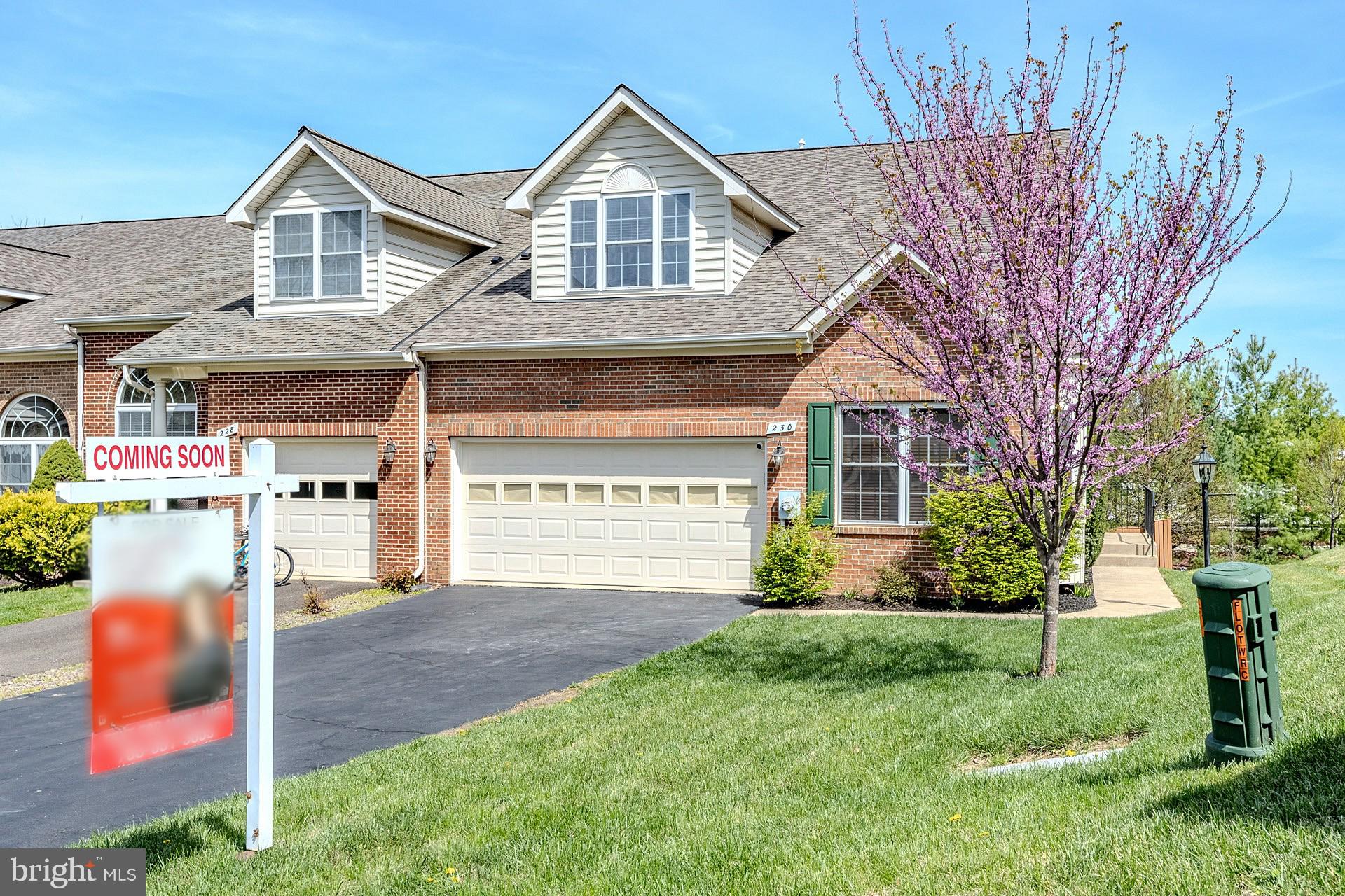 230 West Ridge Court Warrenton, VA 20186 - Photo 2 of 44 a front view of a house with a yard and garage