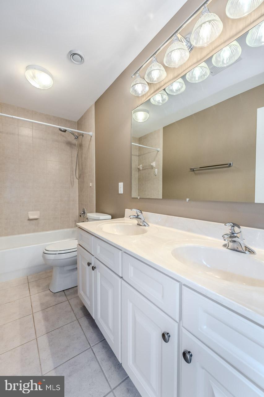 230 West Ridge Court Warrenton, VA 20186 - Photo 29 of 44 a bathroom with a double vanity sink toilet and shower