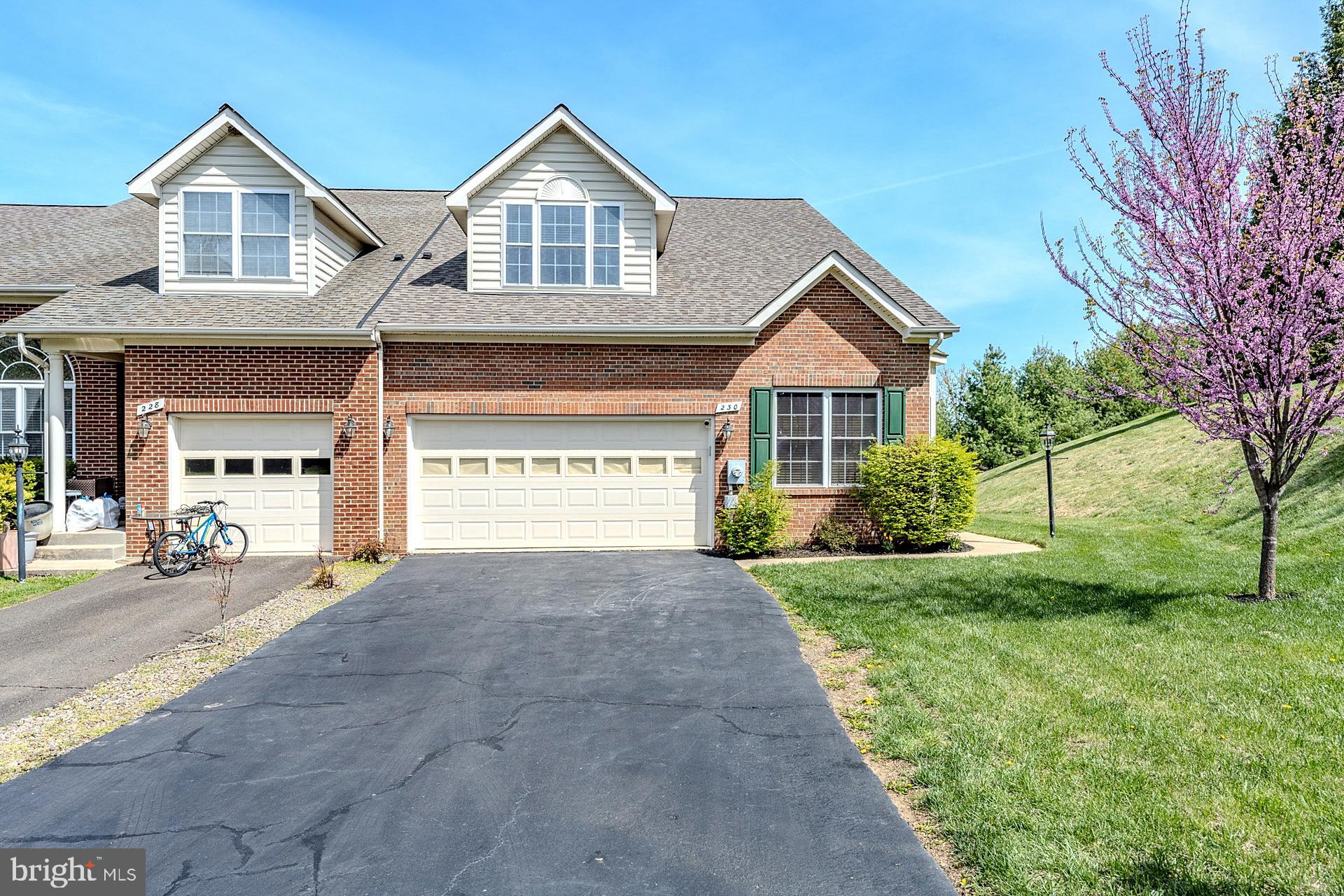 230 West Ridge Court Warrenton, VA 20186 - Photo 3 of 44 a front view of a house with a yard and garage