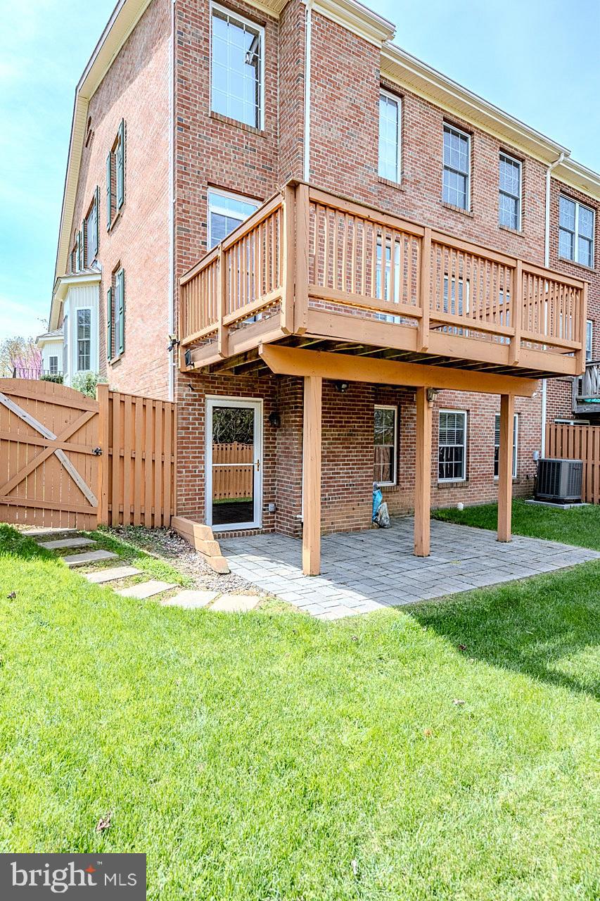 230 West Ridge Court Warrenton, VA 20186 - Photo 43 of 44 front view of a brick building with a yard