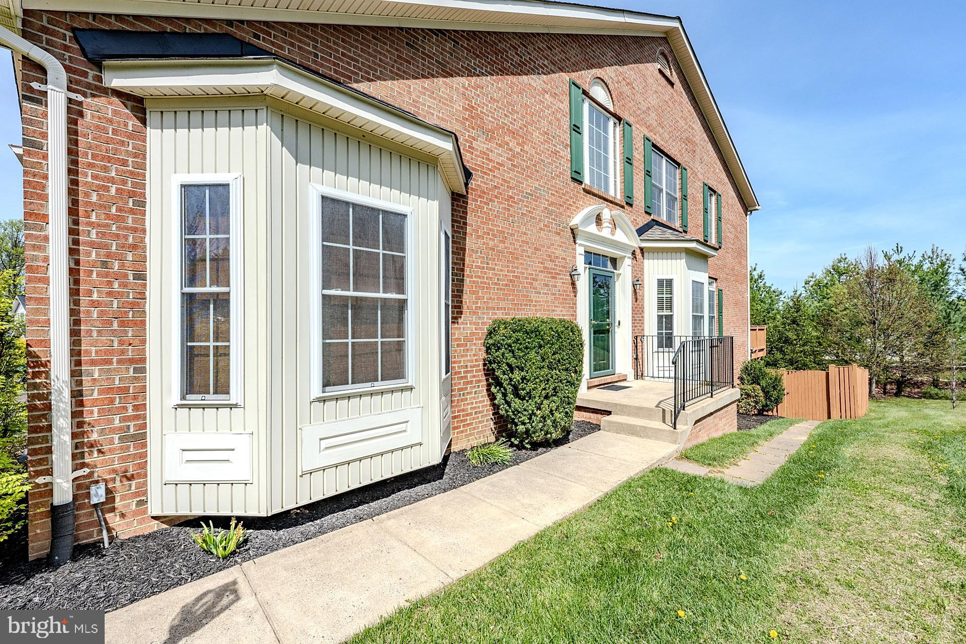 230 West Ridge Court Warrenton, VA 20186 - Photo 5 of 44 a front view of a house with garden
