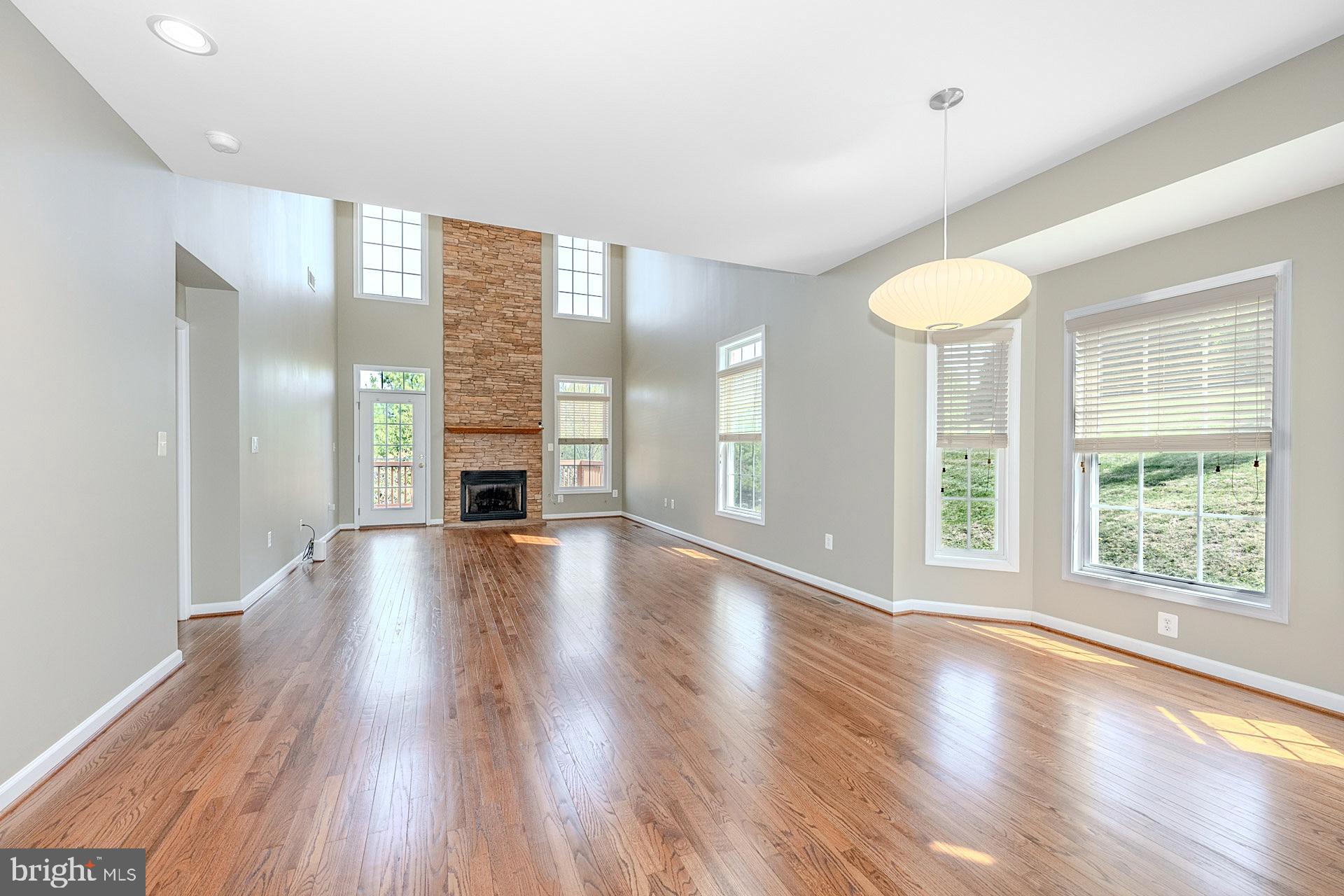 230 West Ridge Court Warrenton, VA 20186 - Photo 9 of 44 a view of an empty room with wooden floor and a window