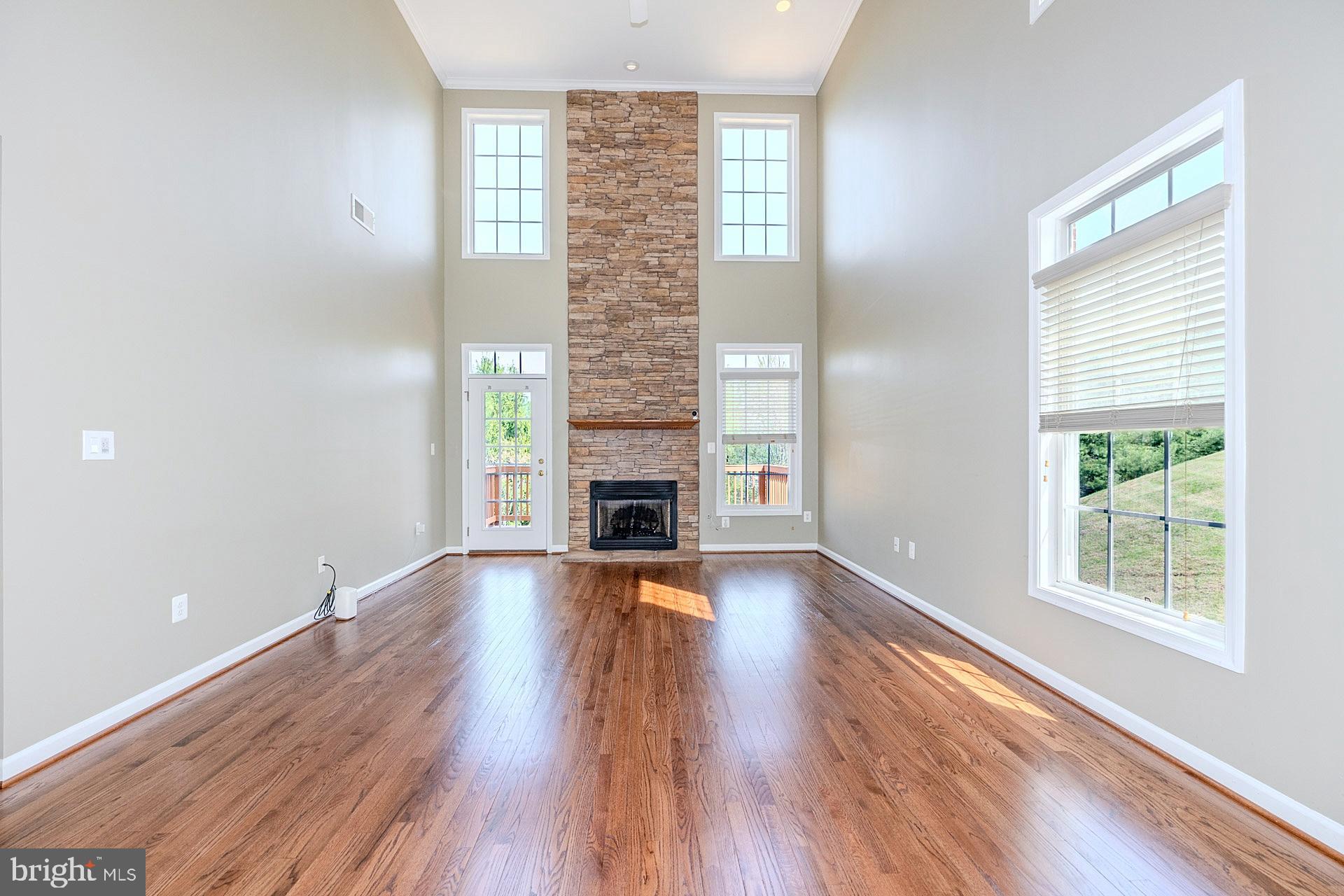230 West Ridge Court Warrenton, VA 20186 - Photo 10 of 44 a view of an empty room with wooden floor and a window