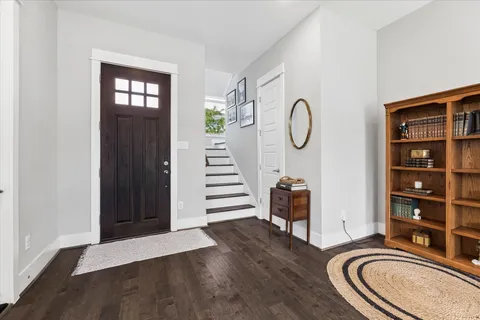 a room with furniture and wooden floor