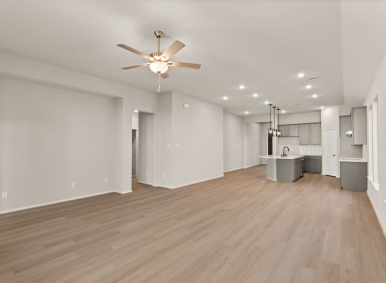 17314 Merry Lea Lane Hockley, TX 77447 - Photo 3 of 7 a view of a kitchen with a sink dishwasher and a refrigerator