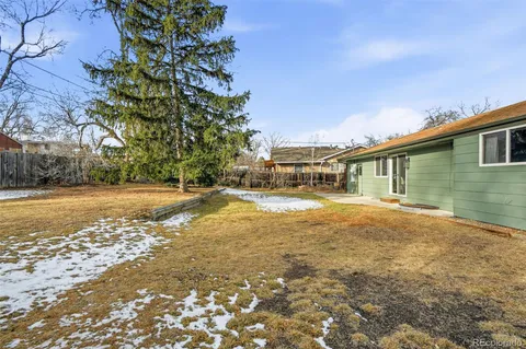a view of house with backyard space