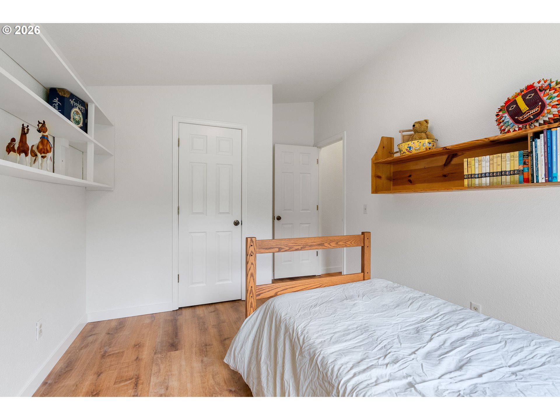 451 Cannavinna Road Carson, WA 98610 - Photo 20 of 33 a bedroom with a bed and a painting on the wall