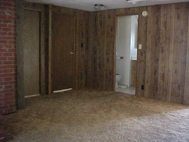2990 Rosenkranz Road Tieton, WA 98947 - Photo 5 of 9 a view of an empty room with wooden walls