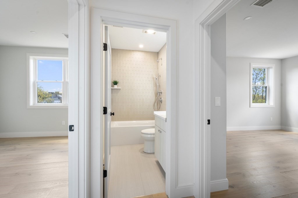 5245 Washington Street, Unit 6 Boston, MA 02132 - Photo 14 of 22 a bathroom with white walls