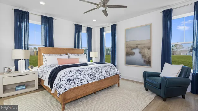 a bedroom with a bed and a couch