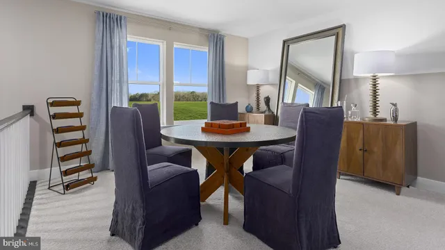 a view of a dining room with furniture window and outside view