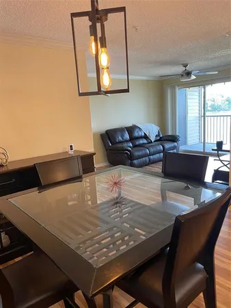 a living room with dining table