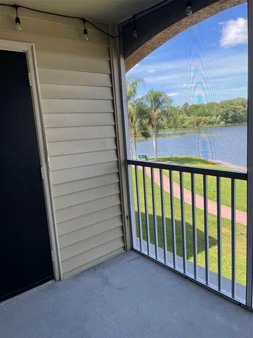 a view of a porch with a floor to ceiling window