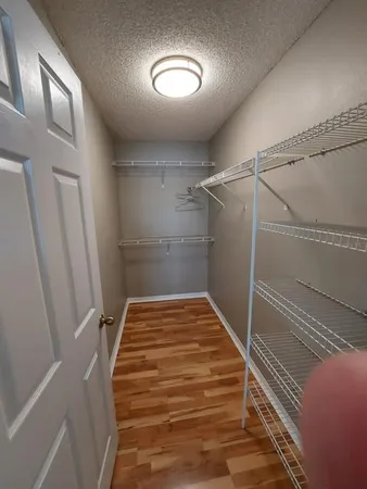 a view of a room with wooden floor and staircase