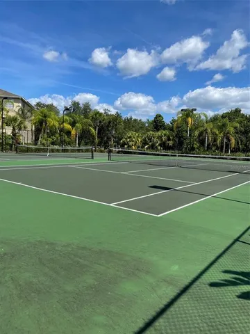a view of an outdoor space and tennis court