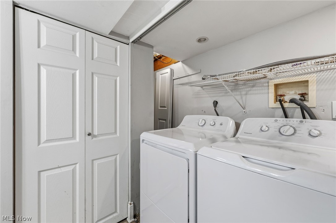6472 Southgrove Road Mentor, OH 44060 - Photo 30 of 37 Dedicated laundry area featuring a white washer and dryer pair, overhead wire shelving, and recessed lighting