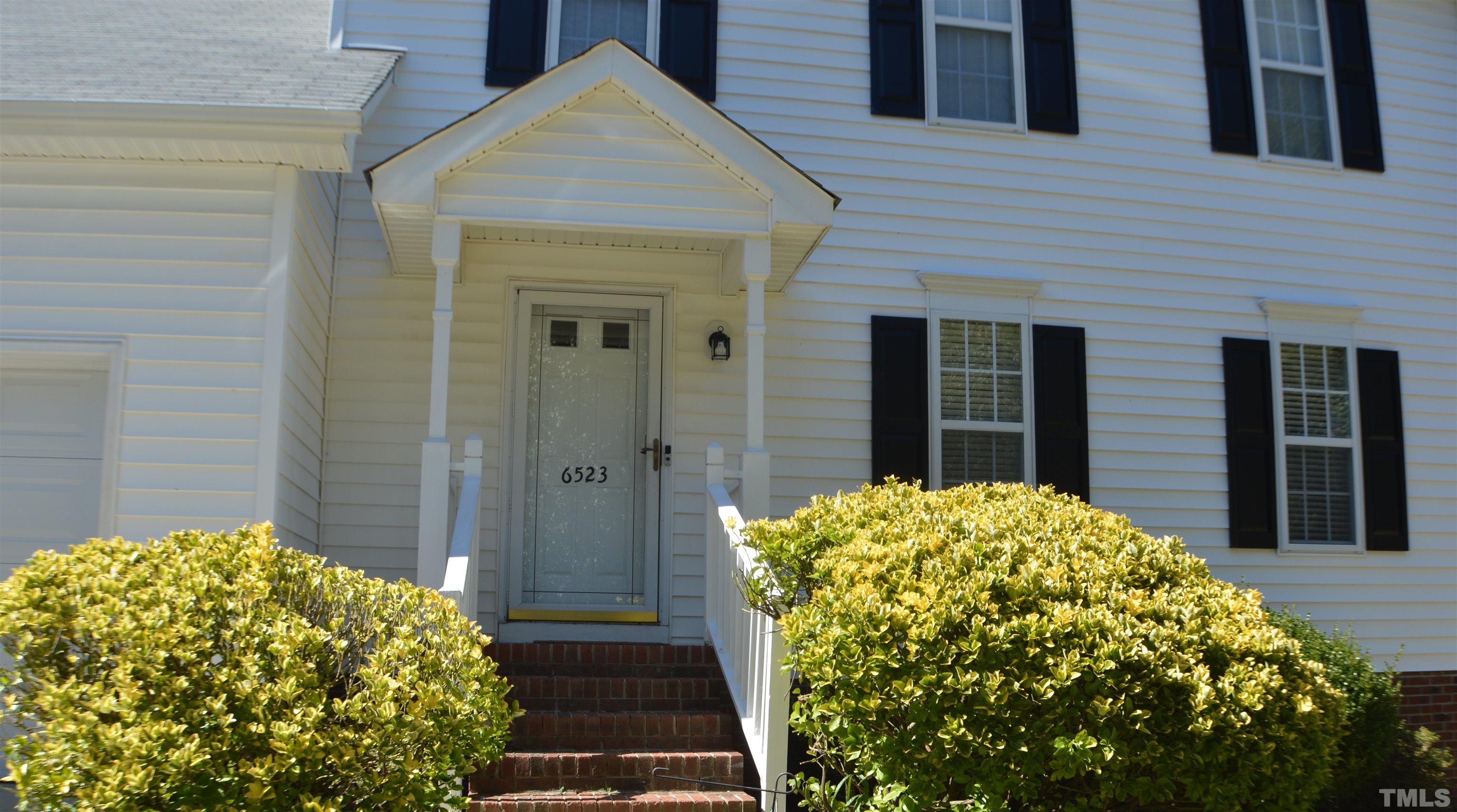 6523 Caverstone Lane Durham, NC 27713 - Photo 1 of 29 a view of a house with a garden