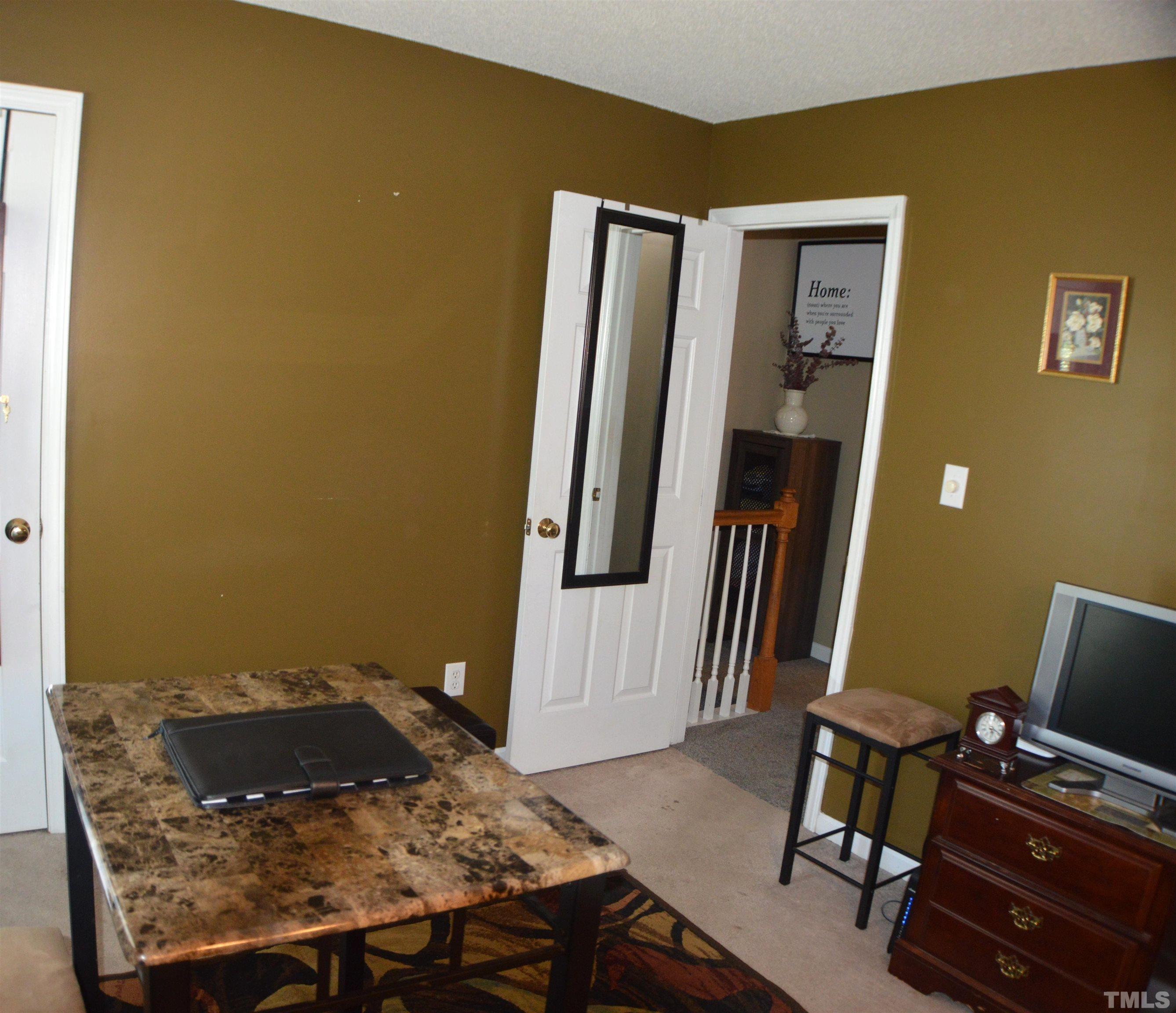 6523 Caverstone Lane Durham, NC 27713 - Photo 13 of 29 a living room with furniture and a window